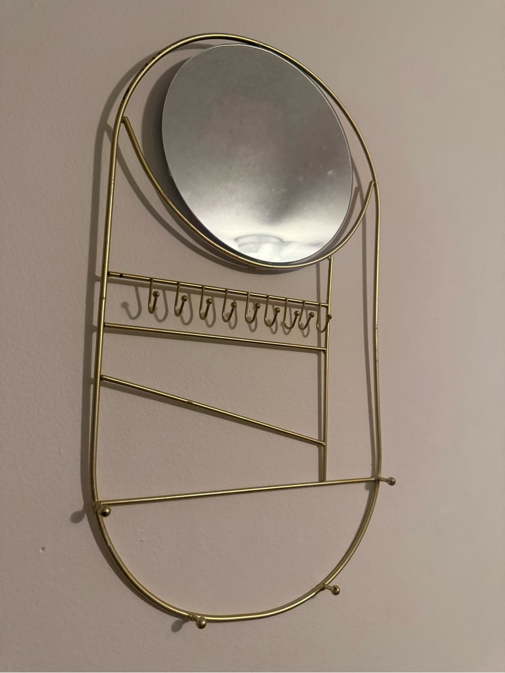 Gold Oval Wall Mirror and Jewelry Organizer